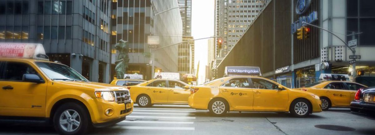What is the origin of taxis and the benefits of hiring a taxi?